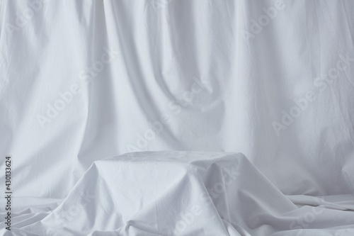 Still life photography product background on white linen sheet