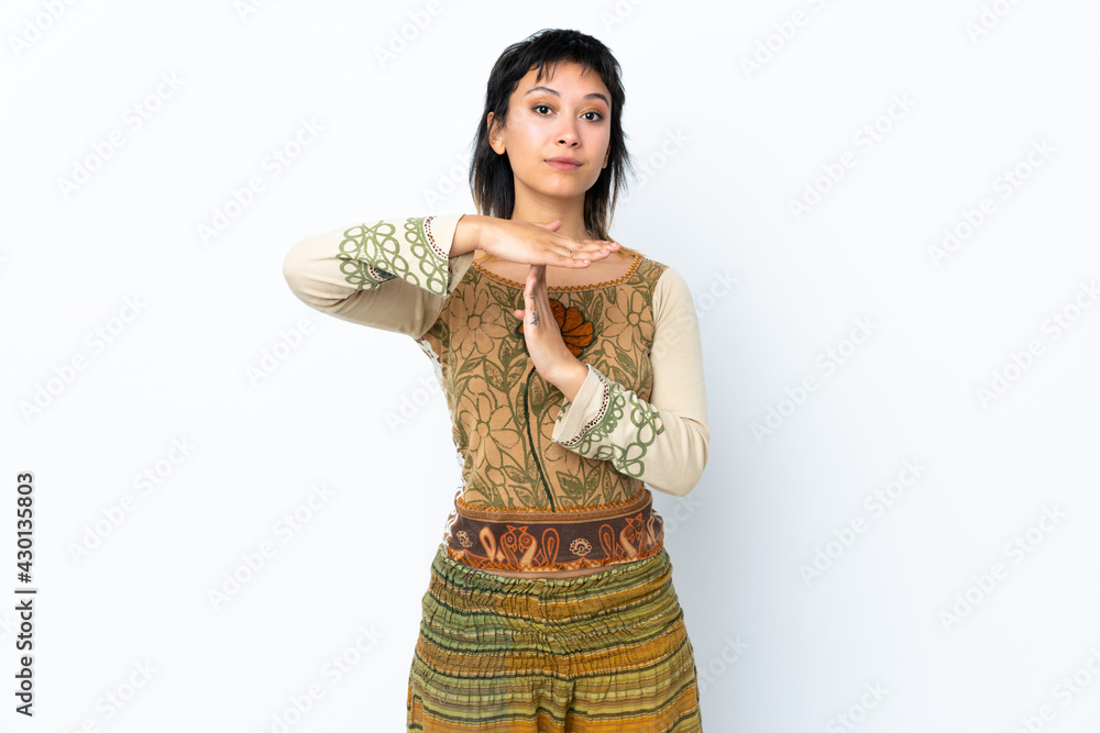 Young Uruguayan girl over isolated white background making time out gesture Young Uruguayan girl over isolated white background making time out gesture