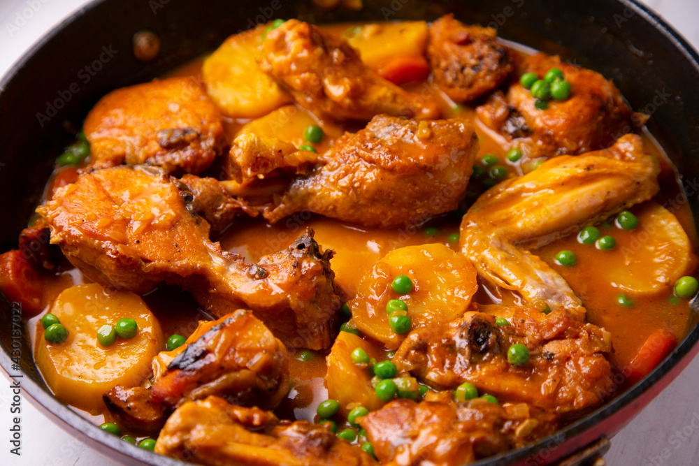 Chicken with potatoes and vegetables. Traditional tapa spanish recipe.