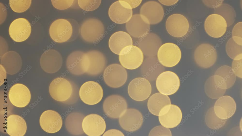 Christmas background - defocused flickering festive garland lights with bokeh effect Christmas background - defocused flickering festive garland lights with bokeh effect