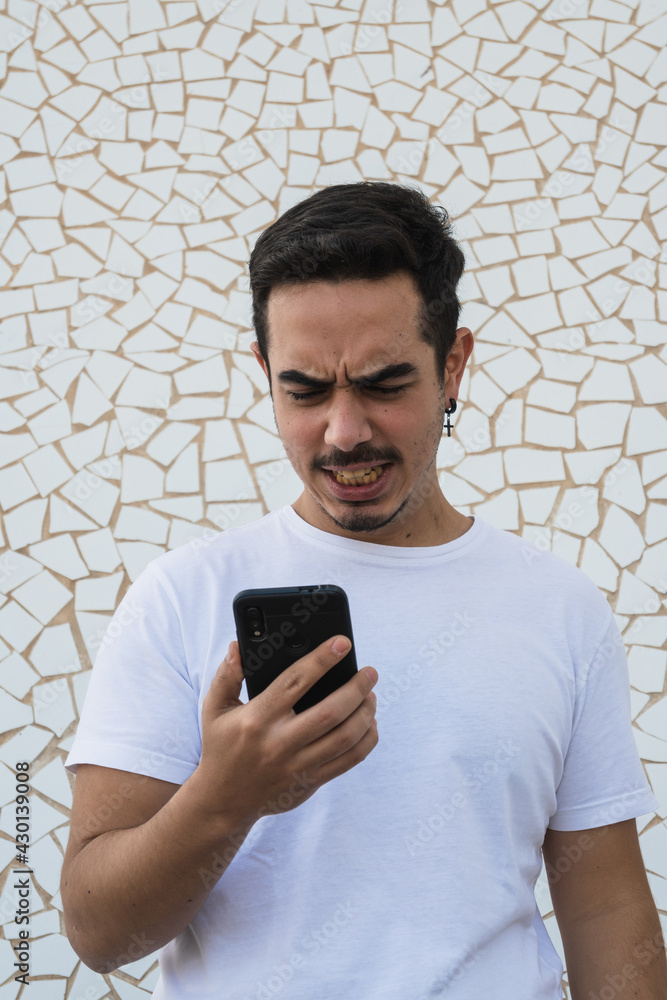 Fototapeta premium Boy in white shirt expressing emotions