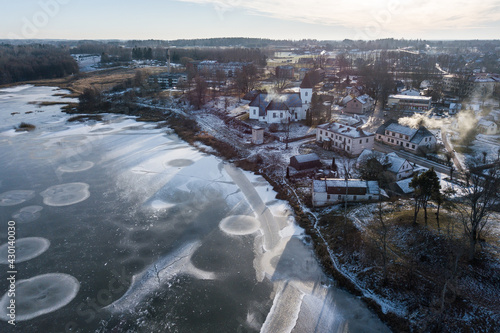 Aerial view of Alsunga village in winter, Latvia. © Bargais