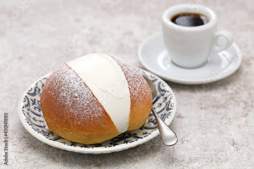 homemade Maritozzo is italian roman breakfast sweet that whipped cream sandwiched between brioche.