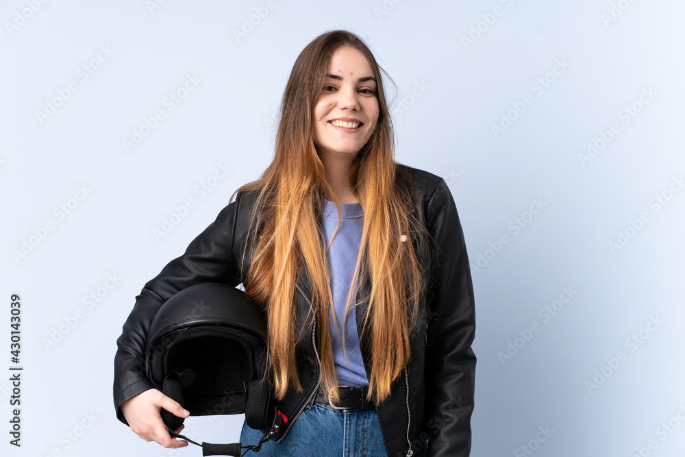Woman with a motorcycle helmet laughing Woman with a motorcycle helmet laughing