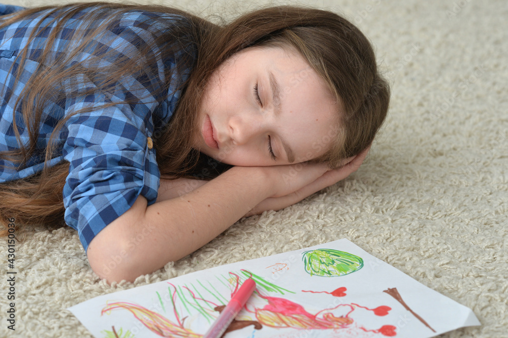 Beautiful girl sleeping on the floor at home Beautiful girl sleeping on the floor at home