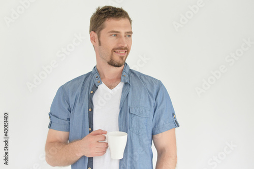 handsome young man drinking coffee