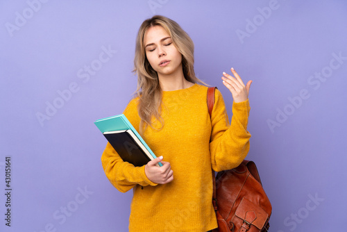 Teenager Russian student girl isolated on purple background with tired and sick expression