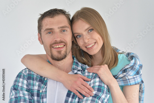 Close up portrait of happy young couple posing at home