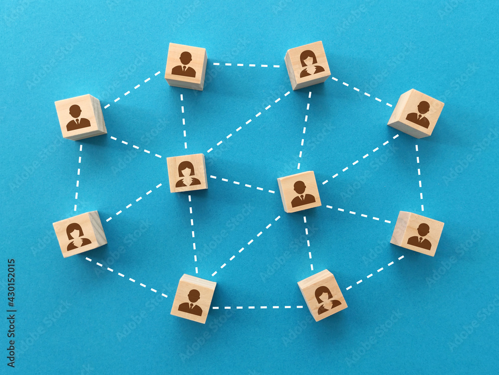 Human resources and management concept, wooden blocks with business people icon on blue background Human resources and management concept, wooden blocks with business people icon on blue background