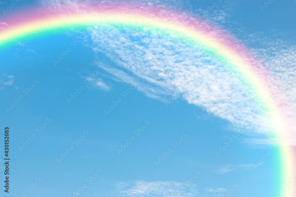 A beautiful rainbow in blue sky background and cloud with copy space.2