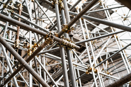 Close-up of scaffolding on the background of the building. Bottom view