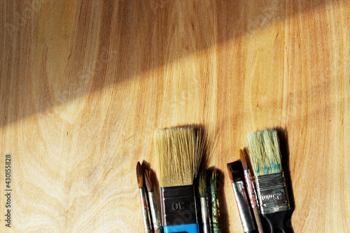 Brushes for drawing on a wooden background