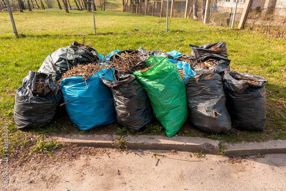 Bags full of garbage collected from park Bags full of garbage collected from park