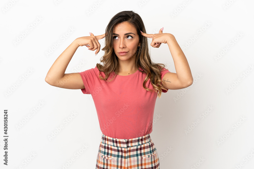 Young woman over isolated background having doubts and thinking Young woman over isolated background having doubts and thinking