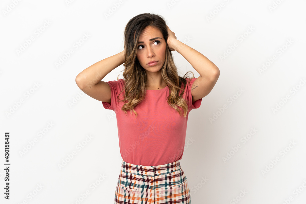 Young woman over isolated background frustrated and covering ears Young woman over isolated background frustrated and covering ears
