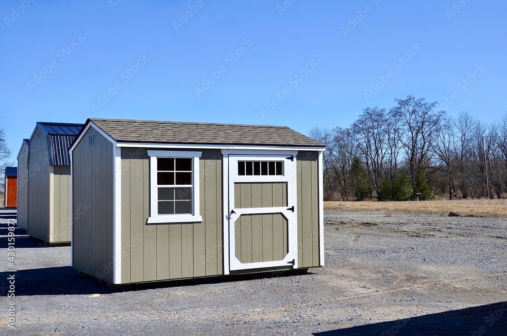 Wooden shed. American shed is typically a simple, single-story roofed structure in a back garden or on an allotment that is used for storage, hobbies, or as a workshop. Wooden shed. American shed is typically a simple, single-story roofed structure in a back garden or on an allotment that is used for storage, hobbies, or as a workshop.
