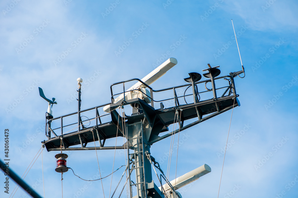 Ships antenna and navigation system in a clear blue sky. Ships antenna and navigation system in a clear blue sky.
