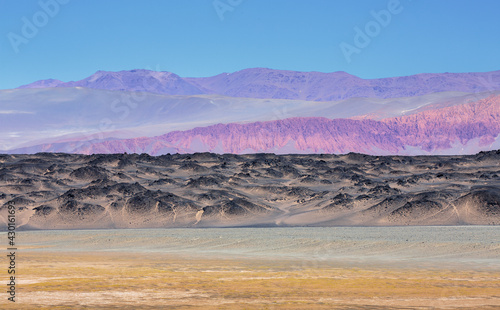 Colorful landscape with mountains  lava flows and volcanic debris in the vicinity of Antofagasta de la Sierra on the high altitude puna  northwest Argentina