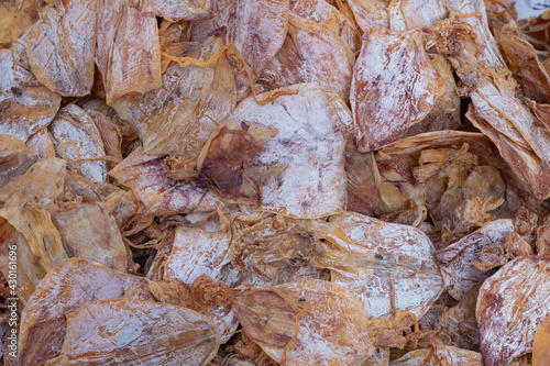 A pile of Dried squid texture background. © Pakorn