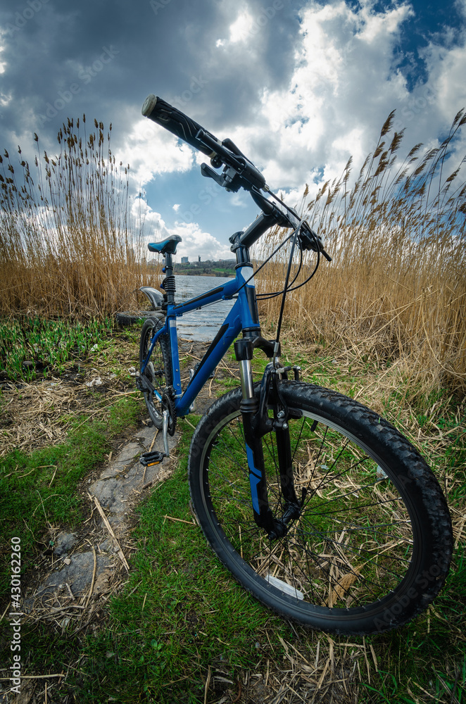 Mountain bike on the background of a spring landscape, spring bike ride