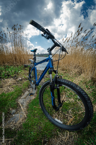 Mountain bike on the background of a spring landscape, spring bike ride
