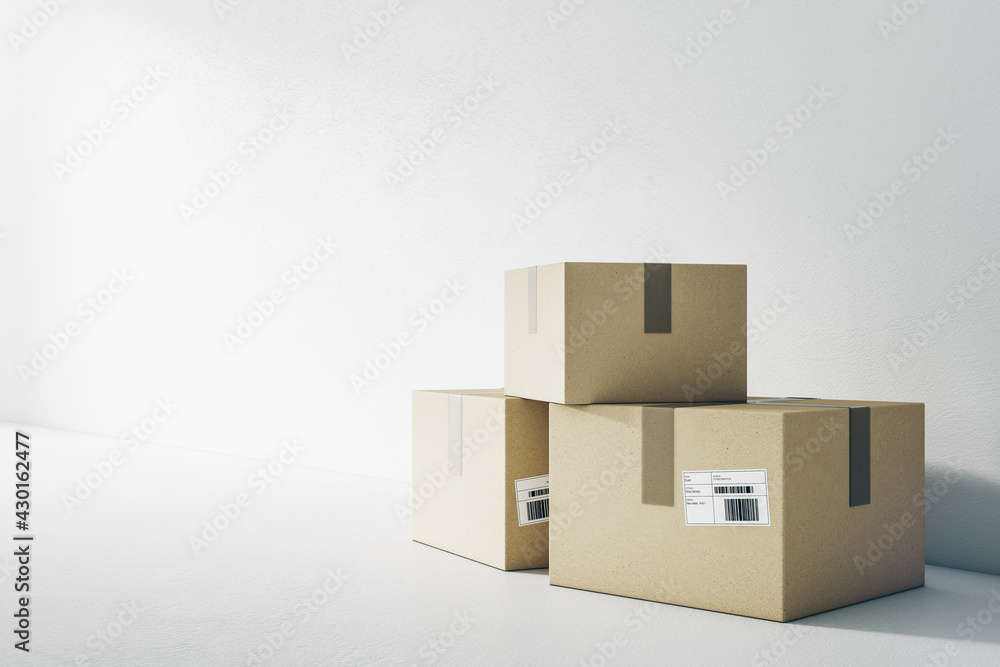 Delivery service concept with cardboard boxes on the floor at blank light wall background. 3D rendering, mockup Delivery service concept with cardboard boxes on the floor at blank light wall background. 3D rendering, mockup