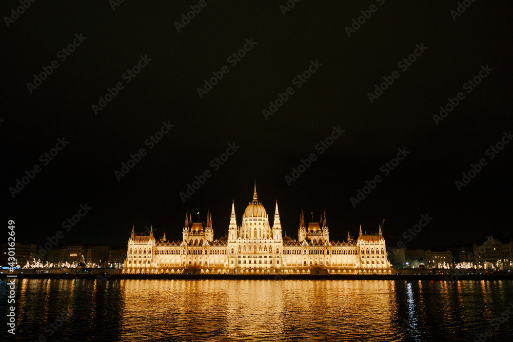 Panoramic view of the Parliament building in beautiful night lighting in Budapest