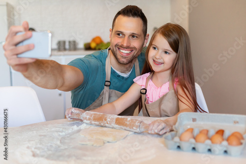 Happy Dad And Daughter Making Selfie Baking Cookies In Kitchen