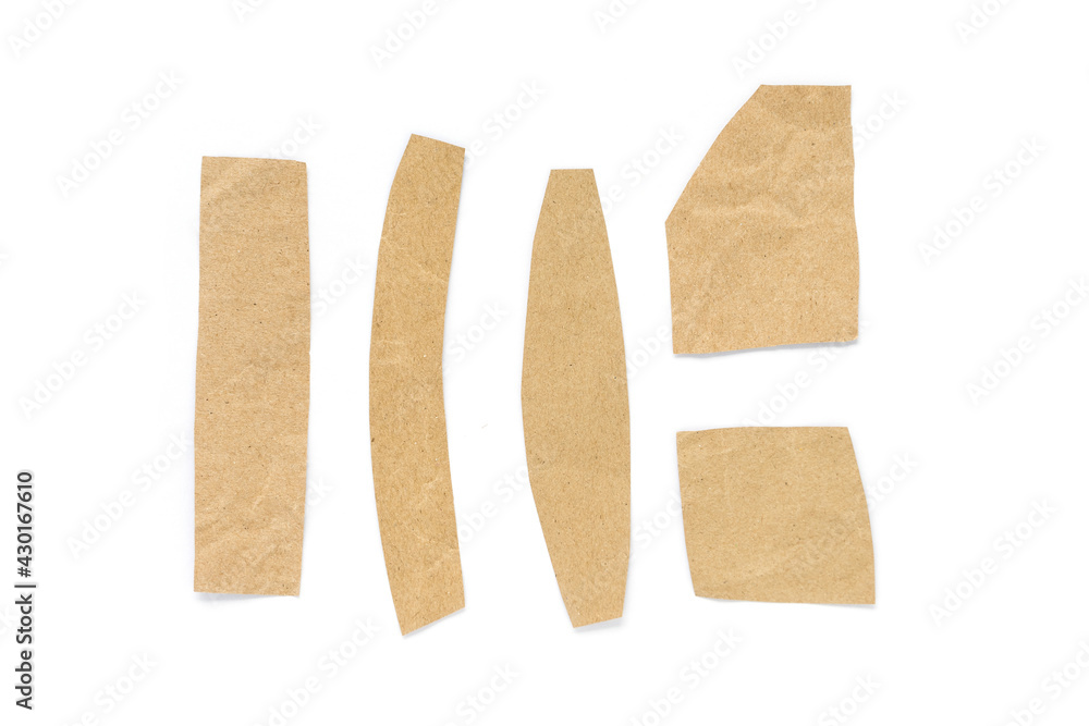 Recycled paper craft stick on a white background. Brown paper torn or ripped pieces of paper isolated on white background. Recycled paper craft stick on a white background. Brown paper torn or ripped pieces of paper isolated on white background.