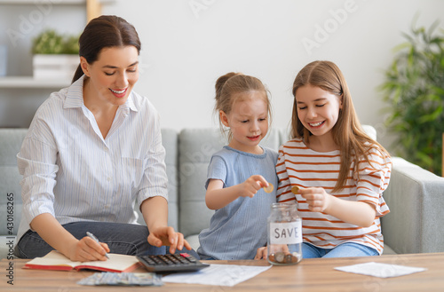 women calculating family budget