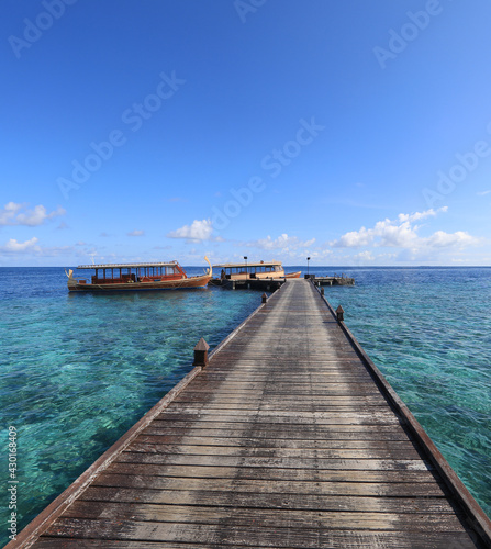 wooden boat on a tropical island  Maldives