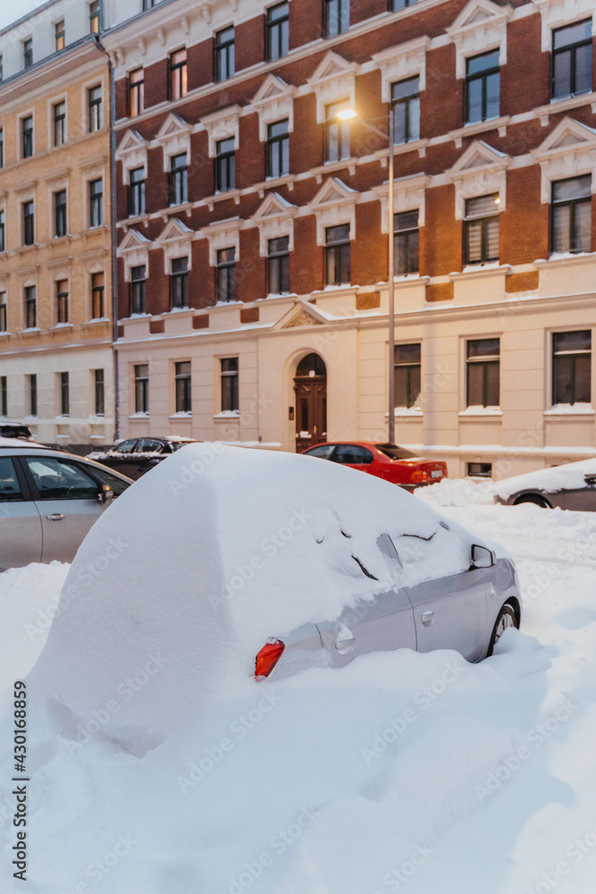 parked cars covered with snow