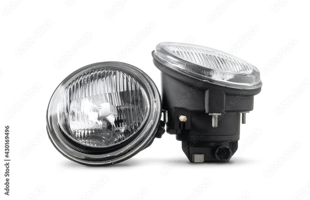 New two fog headlights isolated on white background. Automotive parts. New two fog headlights isolated on white background. Automotive parts.