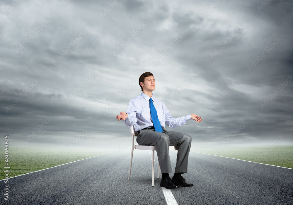 businessman meditates on office chair businessman meditates on office chair
