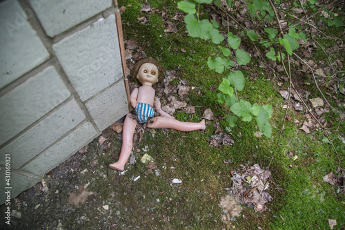 Broken doll on the street in the city of Pripyat (Chernobyl)