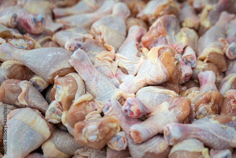 Raw fresh meat of chicken leg (drumstick) selling on local market stall. Raw food and cooking ingredient photo. Raw fresh meat of chicken leg (drumstick) selling on local market stall. Raw food and cooking ingredient photo.