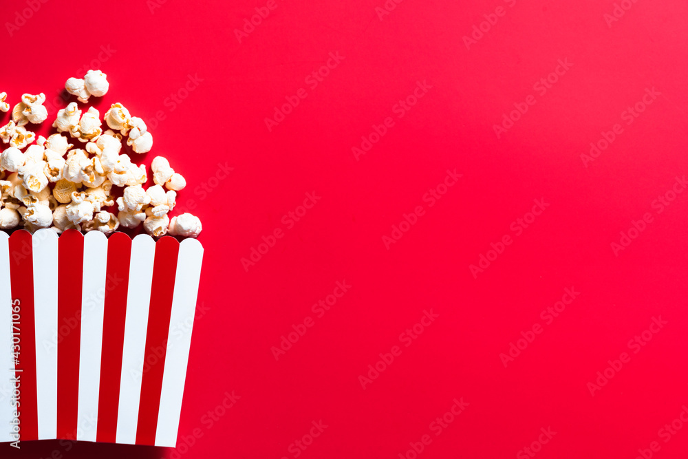 Cinema Popcorn Strtiped Box. Red Border Background. Watching Movies Concept. Flat Lay Still Life Image