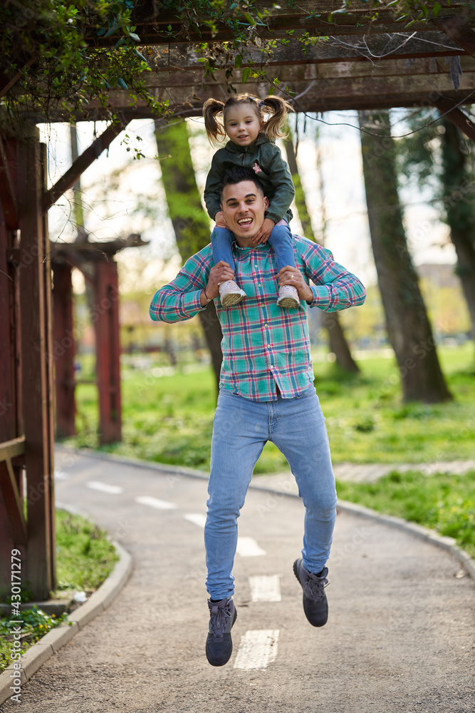 Happy father and daughter in the park Happy father and daughter in the park