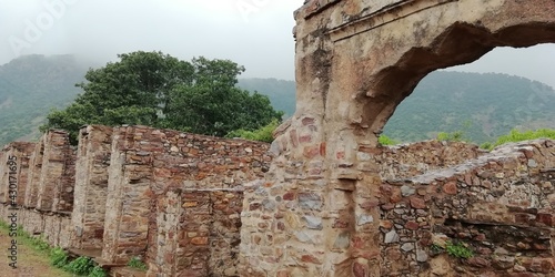 Bhangarh fort and greenery photos in a pleasant weather in Rajasthan photo