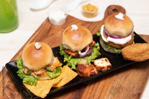 High-angle shot of three chicken miniburgers photo