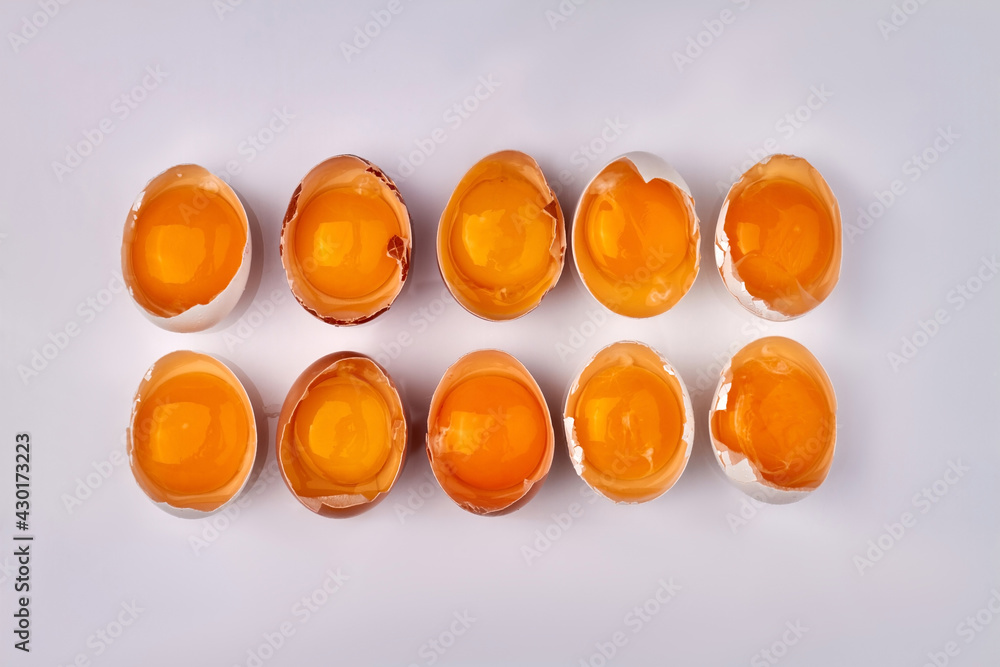 Half broken chicken eggs on white background. Half broken chicken eggs on white background.