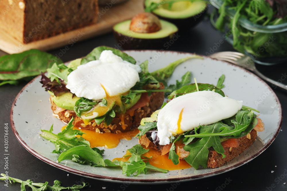 Homemade sandwiches with salmon, avocado and poached eggs Homemade sandwiches with salmon, avocado and poached eggs