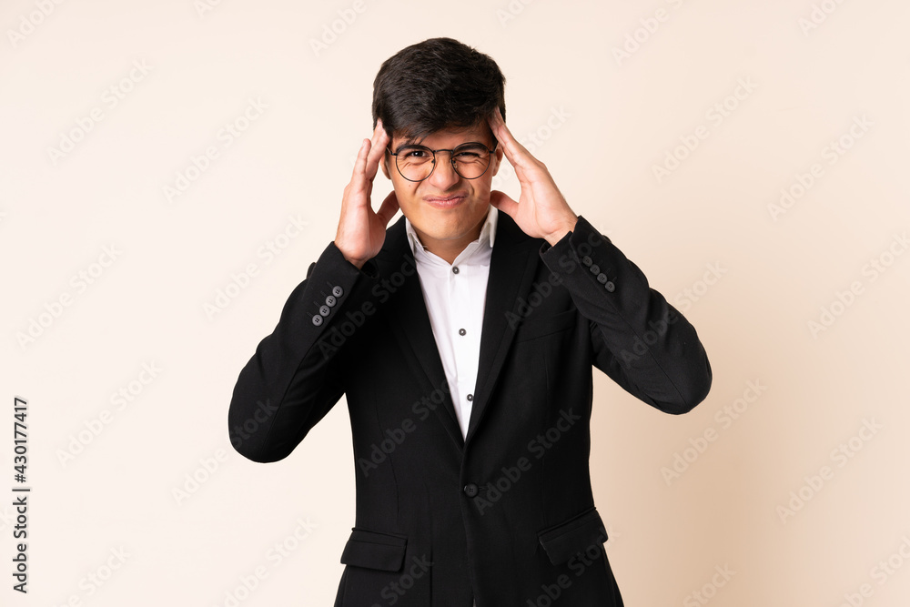 Businessman over isolated beige background unhappy and frustrated with something. Negative facial expression Businessman over isolated beige background unhappy and frustrated with something. Negative facial expression