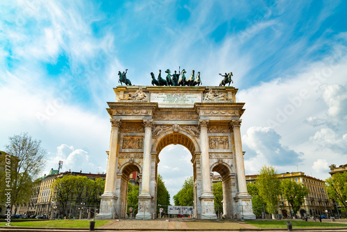 The famous "Arco della pace" (meaning "Arch of the peace) located in Milan, Italy, close to Sempione Park. Dramatic sky on the background.
