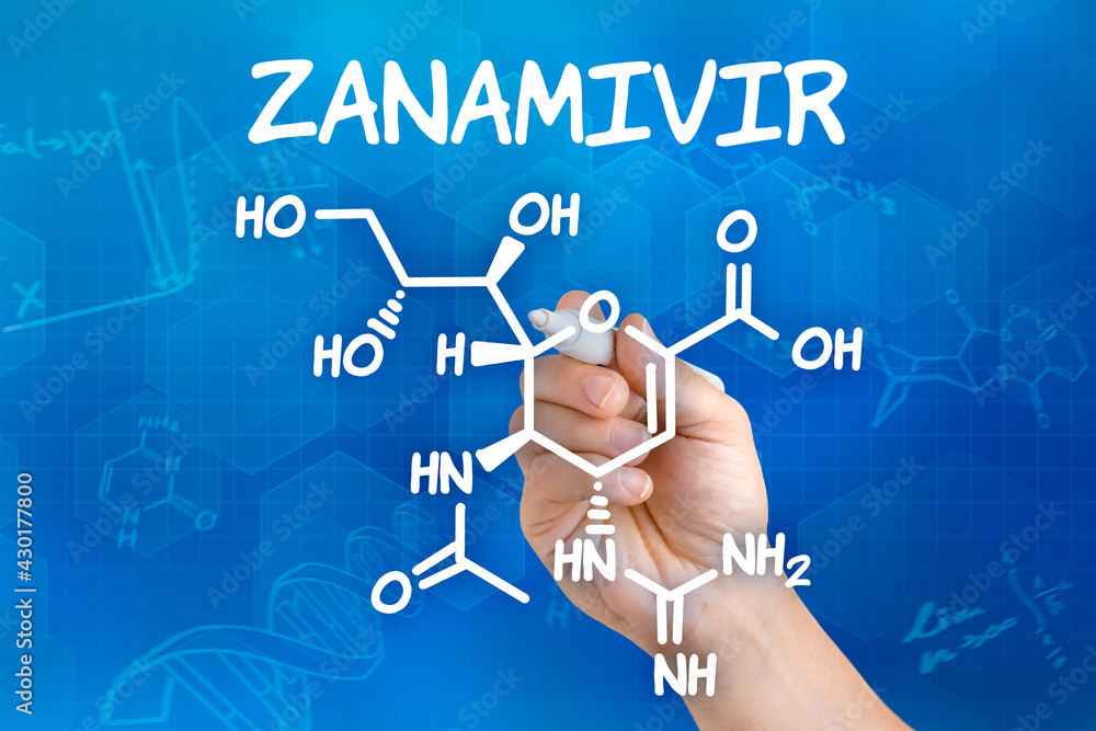 Hand with pen drawing the chemical formula of Zanamivir Hand with pen drawing the chemical formula of Zanamivir