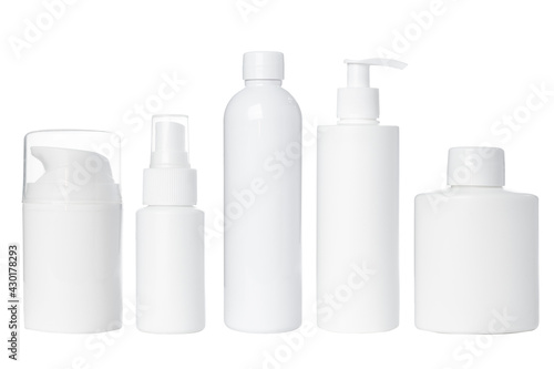 empty white plastic bottles for cosmetics on white background. Isolated