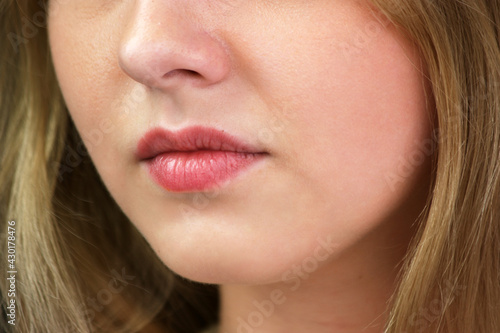 Close up pink lips of a beautiful girl.