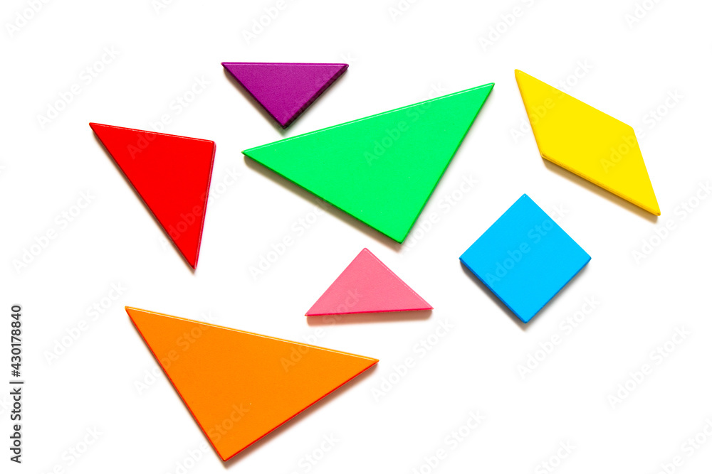 Color wood tangram puzzle in geometric shape wait to build on white background Color wood tangram puzzle in geometric shape wait to build on white background