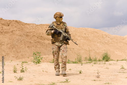 Equipped and armed special forces soldier during military operation