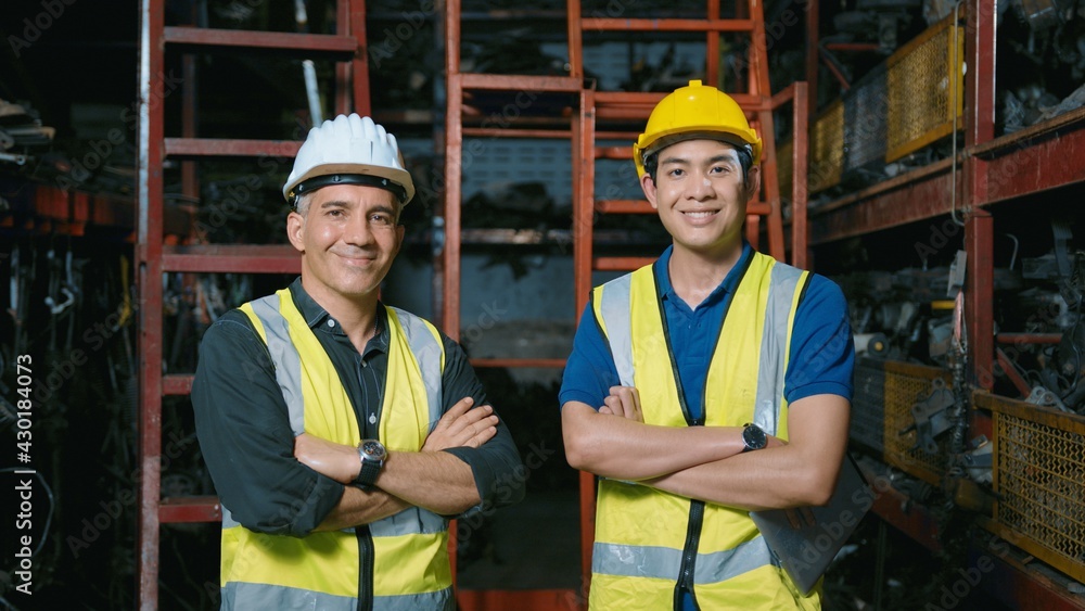 portrait of Caucasian Engineering people working in heavy industrial plant Engine parts factory .. portrait of Caucasian Engineering people working in heavy industrial plant Engine parts factory ..